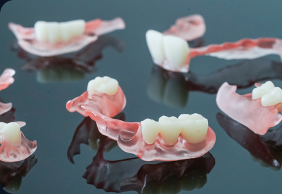 Several 3D-printed flexible partial dentures with pink bases