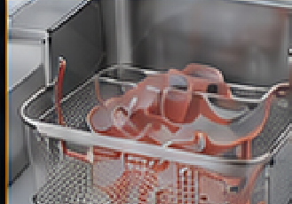 Printed parts in the wash-and-cure basket